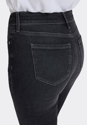 Dark-wash jeans made of denim, featuring a high waist, slim fit, and back pockets with subtle stitching details.