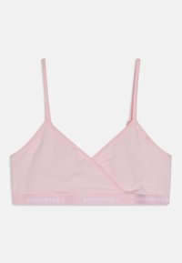 Rosa trådløs bralette med innpakningsdesign, laget av mykt stoff. Har tynne justerbare stropper og en kontrasterende hvit "CONVERSE" logo-bånd.