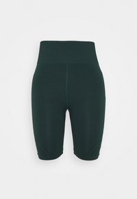 Pantaloncini sportivi verde scuro con vita alta, caratterizzati da dettagli testurizzati e un tessuto liscio ed elastico.