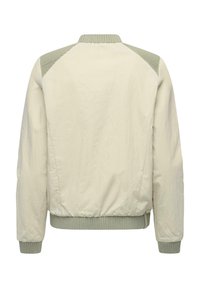 Veste bomber beige clair avec poignets, ourlet, col et patchs d'épaule côtelés en gris-vert clair, vue de dos.