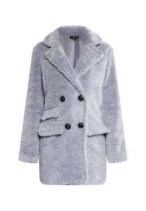 Harmaa villatakki, jossa on kaksoisnapitus, suuret mustat napit, kauluskannet ja sivutaskut. Pehmeä, teksturoitu kangas ja rento leikkaus.