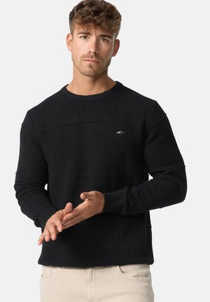 Maglione nero a maglia con strisce orizzontali texture, polsini a coste e scollo rotondo. Dettaglio logo sottile sul petto.