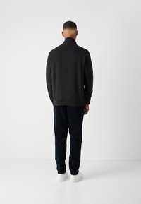 Tommy Hilfiger ESSENTIAL ZIP UNISEX - Melegítőfelső - black