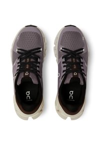 Purple mesh athletic shoes with grey accents and thick white soles. Features black laces and branded insoles. Designed for comfort and support.