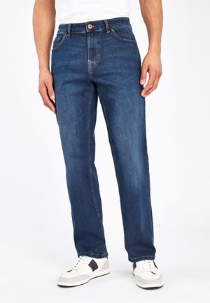 Dunkelblaue Jeans aus Denim mit einem geraden Bein-Design, ausgestattet mit einem Knopfverschluss, Fronttaschen und kontrastierenden Nähte.