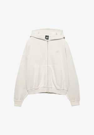 Lyse beige zip-up hoodie. Blanding af bomuld, hætte med snøre, kengurulommer, ribbede manchetter, rå kantdetaljer og diskret logo på brystet.