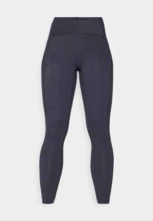 High-waisted, dark gray leggings with smooth, stretchy fabric, featuring side seams and ankle openings without visible logos or patterns.