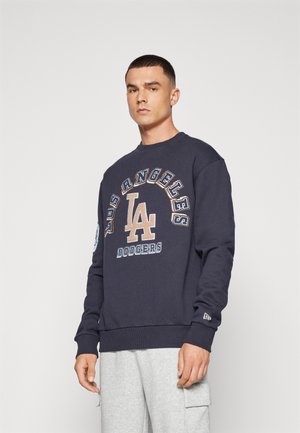 Navy blue sweatshirt featuring "Los Angeles Dodgers" and logo prints in beige and white, cotton material, ribbed cuffs and hem.