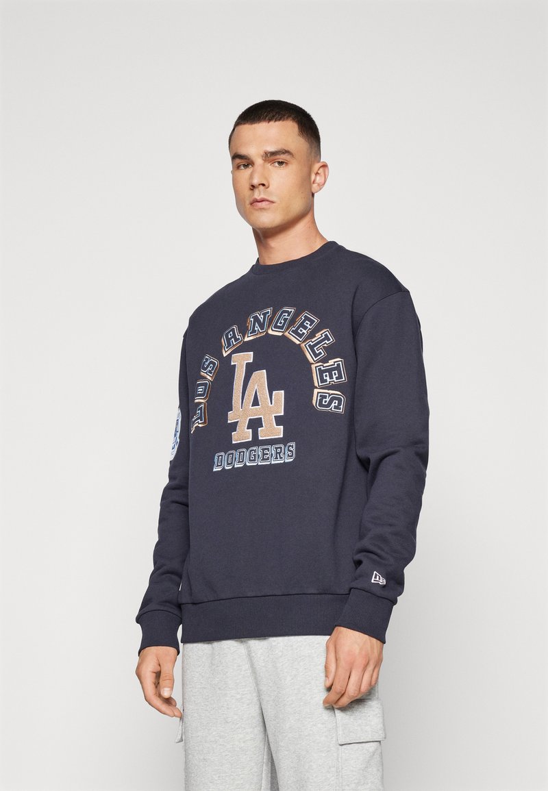 Sweatshirt bleu marine avec les inscriptions "Los Angeles Dodgers" et logos en beige et blanc, en coton, avec des poignets et un ourlet côtelés.