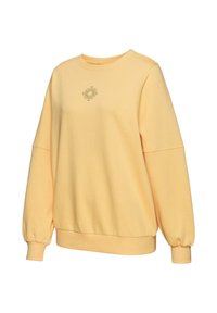 Gelbes Sweatshirt aus weichem Stoff mit Rundhalsausschnitt, gerippten Bündchen und einem kleinen Grafikdesign auf der Brust.