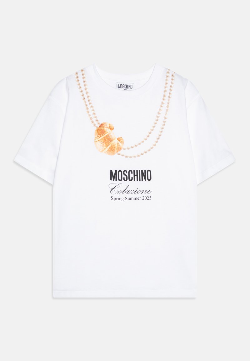 White cotton t-shirt featuring a croissant graphic and pearl bead design, with "Moschino Colazione Spring Summer 2025" printed below.