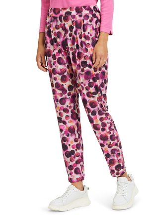 Colorful, patterned trousers featuring a mix of purple, pink, and orange dots. Made from lightweight fabric, with a relaxed fit and elastic waistband.