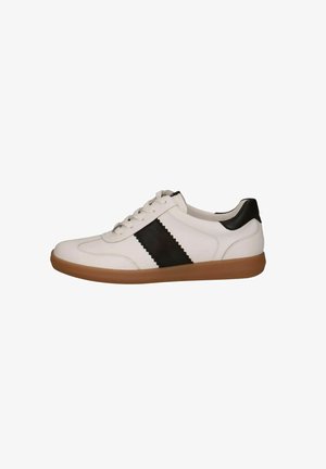 White leather sneaker with a black zigzag stripe, featuring a brown rubber sole and round toe, finished with matching black heel accent.