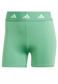 Zelené sportovní šortky vyrobené z hladkého materiálu. Mají bílé logo na pase a minimální švy. Délka ke kolenům pro přiléhavý vzhled.