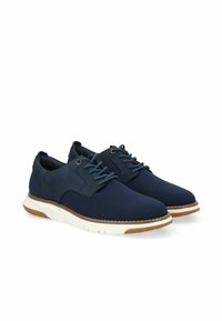 Zapatillas de malla azul marino con un upper texturizado, media suela blanca y suela exterior de goma marrón claro. Presenta cordones redondos y ojales de metal.