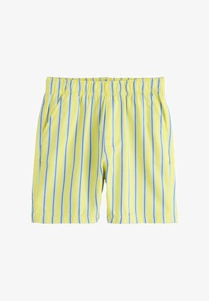 Żółte spodenki z elastycznym pasem, z pionowymi niebiesko-białymi paskami i kieszeniami po bokach, na białym tle.