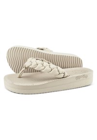 Beige flip-flops with braided straps, textured footbed, and ridged sole for traction. Made from flexible rubber material.