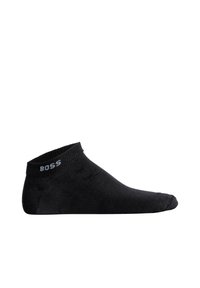 Calcetín negro hasta el tobillo hecho de una tela suave, con un puño acanalado y el logotipo "BOSS" en blanco en el lateral. Textura suave y diseño sin costuras.