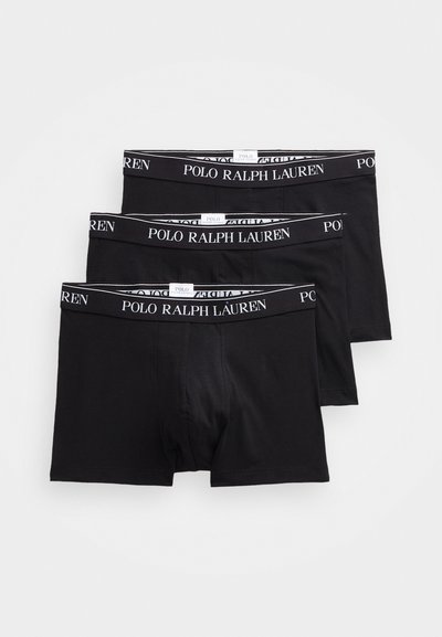 Melni kokvilnas bokseri ar melnu un baltu elastīgu jostu, uz kuras ir teksts 'POLO RALPH LAUREN'. Trīs pāri sakrauti, vienkāršs dizains.