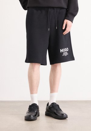 NOMARIO - Tracksuit bottoms - black