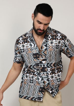 Short-sleeve button-up shirt with abstract multicolored patterns in black, brown, turquoise, and white. Made of lightweight fabric.