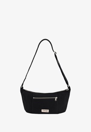 Black fabric handbag with a curved shape, featuring a zippered compartment, a front pocket, and an adjustable strap. Branding label attached.