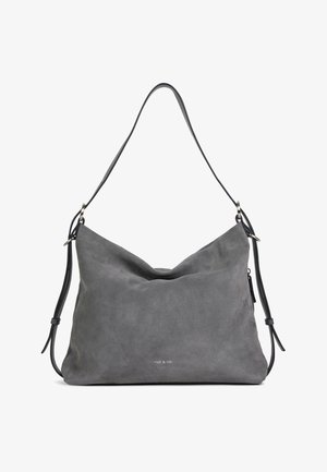 Sac à bandoulière en daim gris avec des bretelles réglables, une forme souple et décontractée, et un petit logo "nat & nin" centré près du bas.