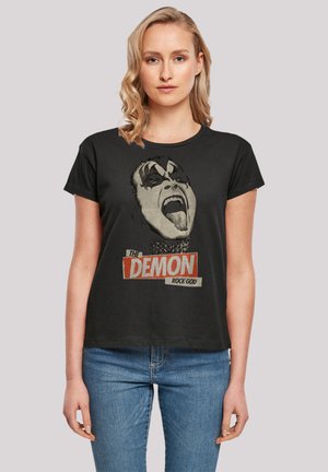 Black cotton t-shirt with a round neck and short sleeves featuring a graphic print of a face with makeup, text "THE DEMON ROCK GOD" below.
