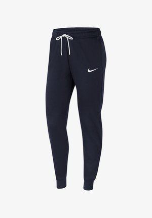 Ciemnoniebieskie dresowe spodnie Nike z elastycznym pasem, białym sznurkiem, zwężanymi nogawkami i białym logo Nike swoosh na lewym udzie.