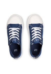 Denim sneakers with white rubber toe caps, white laces, and a blue fabric lining. Features logo on the tongue and heel tab.