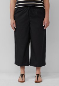 Schwarze, cropped Hosen mit einem elastischen Bund, gefertigt aus leichtem Stoff, mit glatter Textur und geradem Bein.}}