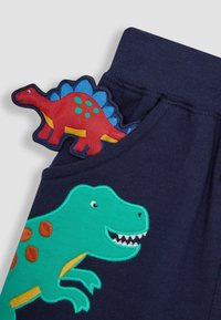 JoJo Maman Bébé APPLIQUE IN POCKET - REGULAR FIT - Tepláky - navy blue dino
