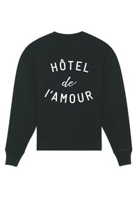 Svart sweatshirt med vit text "HÔTEL de l'AMOUR" tryckt på ryggen i böjda linjer, med långa ärmar och ribbade manschetter och hem.