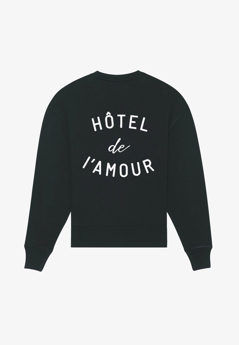 Black sweatshirt with white text "HÔTEL de l'AMOUR" printed on the back in curved lines, featuring long sleeves and ribbed cuffs and hem.