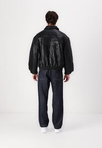 Vertere Berlin RACING JACKET UNISEX - Veste en similicuir - black