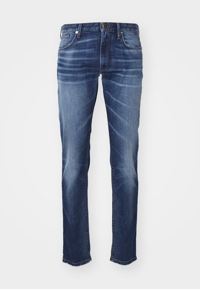 Jeans din denim de culoare bleumarin închis, cu o croială dreaptă, având decolorări subtile, design clasic cu cinci buzunare și închidere cu buton.