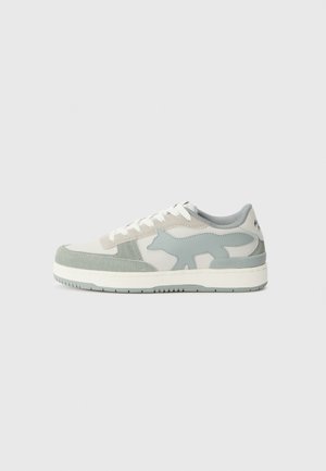Sneakers featuring a combination of light gray and mint green suede, with a distinctive fox logo on the side and white laces.