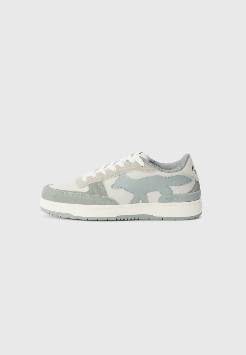 Sneakers featuring a combination of light gray and mint green suede, with a distinctive fox logo on the side and white laces.
