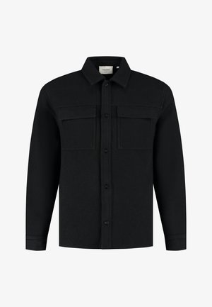 Zwarte overhemd met knopen gemaakt van gestructureerde stof, met twee borstzakken, een kraag en lange mouwen. Voorkant met knoopsluiting.