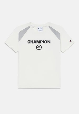 Balta trumpa darbo marškinėliai su pilkais tinkliniais akcentais ant pečių ir juodu "CHAMPION" logotipu per krūtinę. Audinys atrodo lygus.