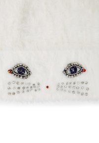 White fur textile featuring crystal-embellished eyes and decorative accents, including purple and red stones, creating a whimsical design.