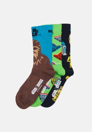 Tre paia di calzini con design: Chewbacca marrone, verde con il volto di Yoda e nero con illustrazioni di R2-D2 e C-3PO. Miscela di cotone.