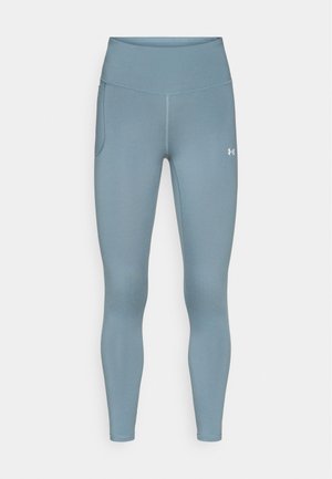 Helle blaue Sportleggings mit hohem Bund, seitlicher Tasche und glattem, dehnbarem Material für erhöhten Komfort und Beweglichkeit.