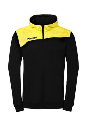 Sort lynlås-hoodie med lange ærmer og et gult geometrisk mønster på skuldre og hætte, med "Kempa" logo på brystet.