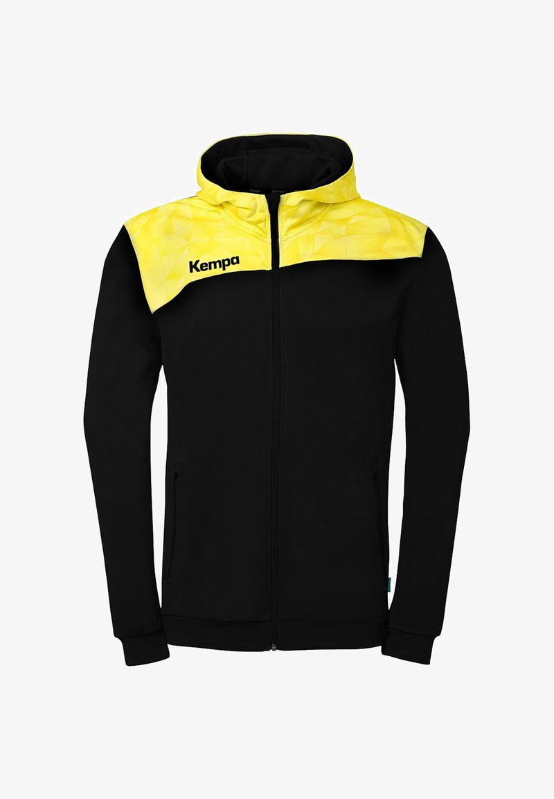 Sweat à capuche noir zippé avec manches longues et un motif géométrique jaune sur les épaules et la capuche, arborant le logo "Kempa" sur la poitrine.