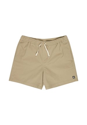Beige Freizeithose mit elastischem Bund und Kordelzug, seitlichen Taschen und einem kleinen schwarzen Logopatch nahe dem unteren Saum.