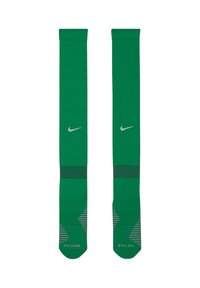 Calze sportive verdi realizzate in materiale sintetico, con il logo Nike grigio, dettagli a strisce e diverse trame sui lati.