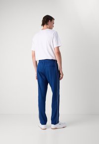 Lacoste Tepláky - globe