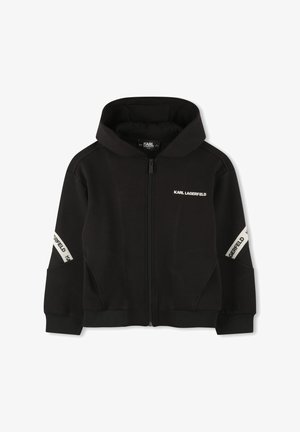 Sweat à capuche noir en tissu doux, avec fermeture éclair sur le devant, capuche surdimensionnée et accents de logo blanc contrastants sur les manches.