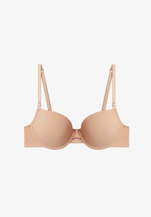 Beige padded bra with smooth cups, adjustable straps, and a subtle center detailing. Made of soft fabric for comfort.